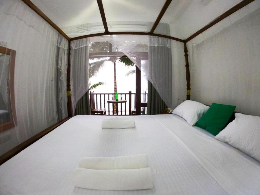 Asa Bay Beach Resort Talpe Εξωτερικό φωτογραφία